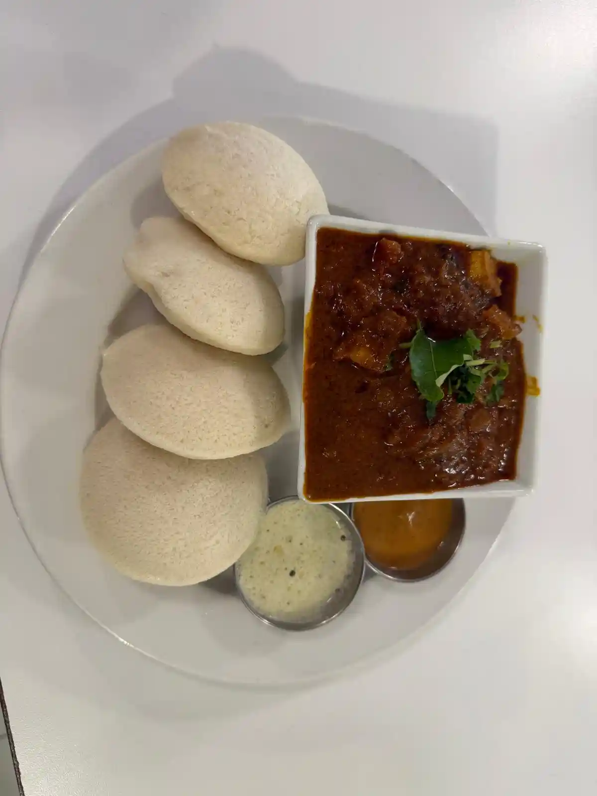 Idli  with Chicken Curry